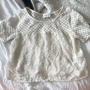 White two-design top, size xs in creme white.